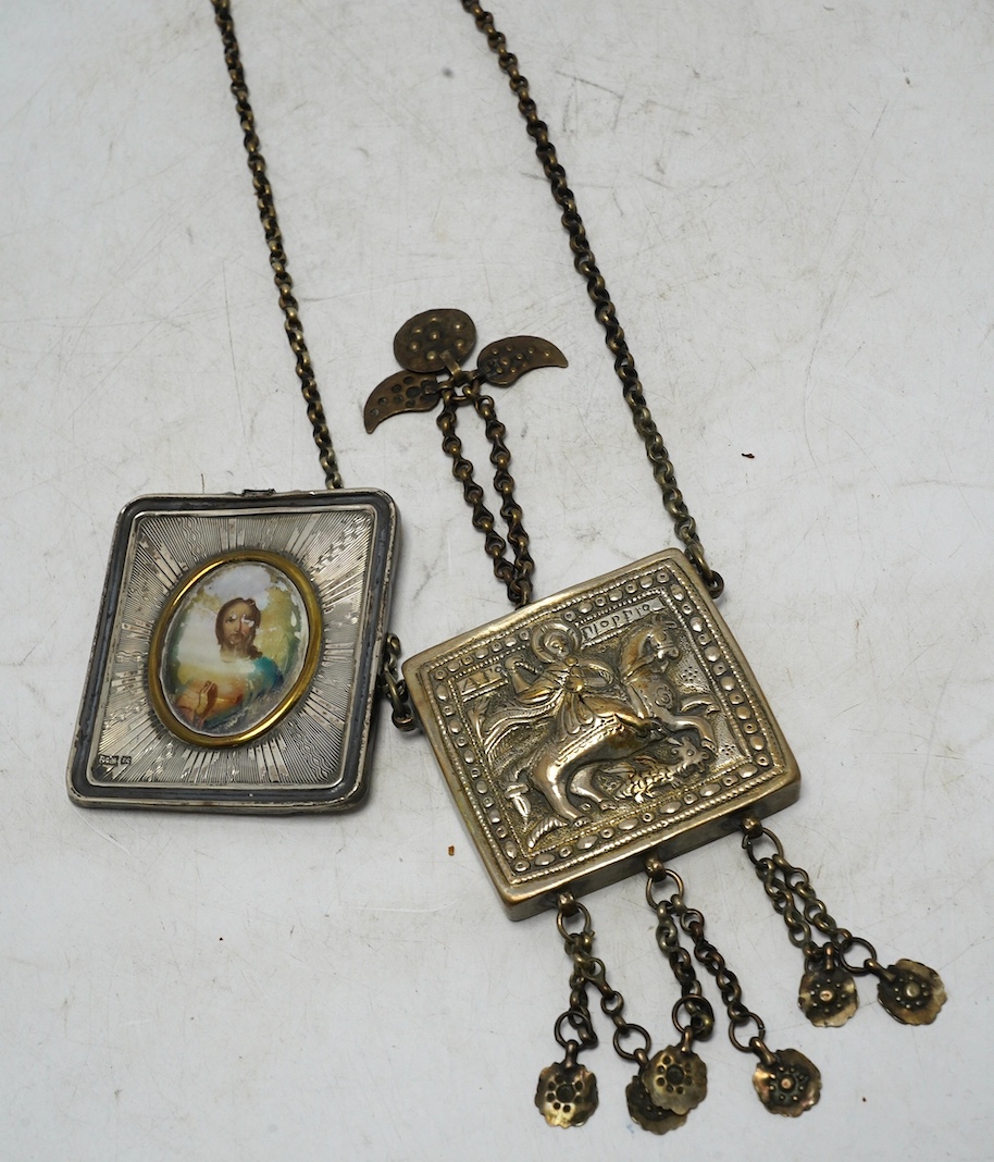 A Greek white metal pendant, embossed with St. George and the dragon, on a chain and a Russian white metal framed portrait of Christ. Condition - poor to fair